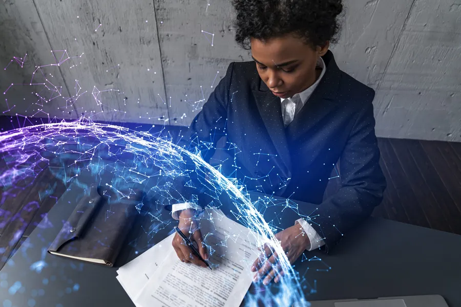 Businesswoman signing a digital contract, representing ownership and approval in an AI policy