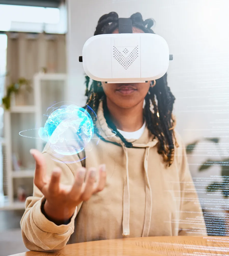 Black student using a virtual reality headset with a globe hologram, representing local AI capability and digital skills