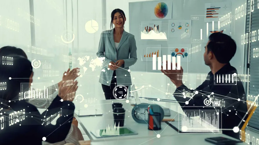 Business team in a corporate training session discussing strategy with envisional graphic
