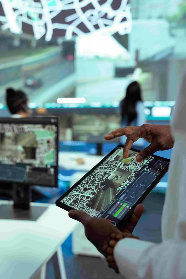 Professional reviewing website analytics on a tablet in a modern tech office