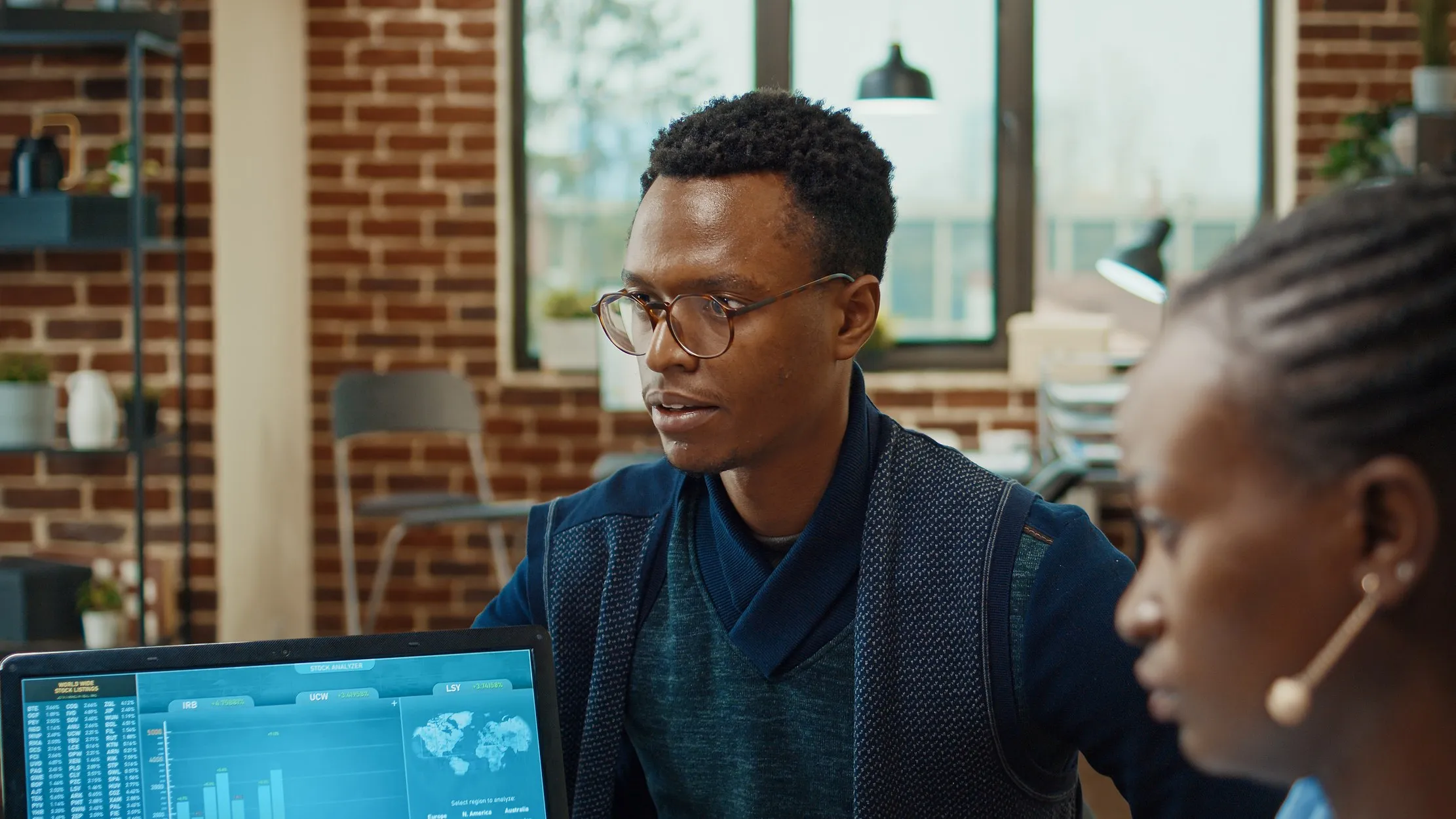 Business professionals reviewing a technology dashboard together before deciding on a vendor or project