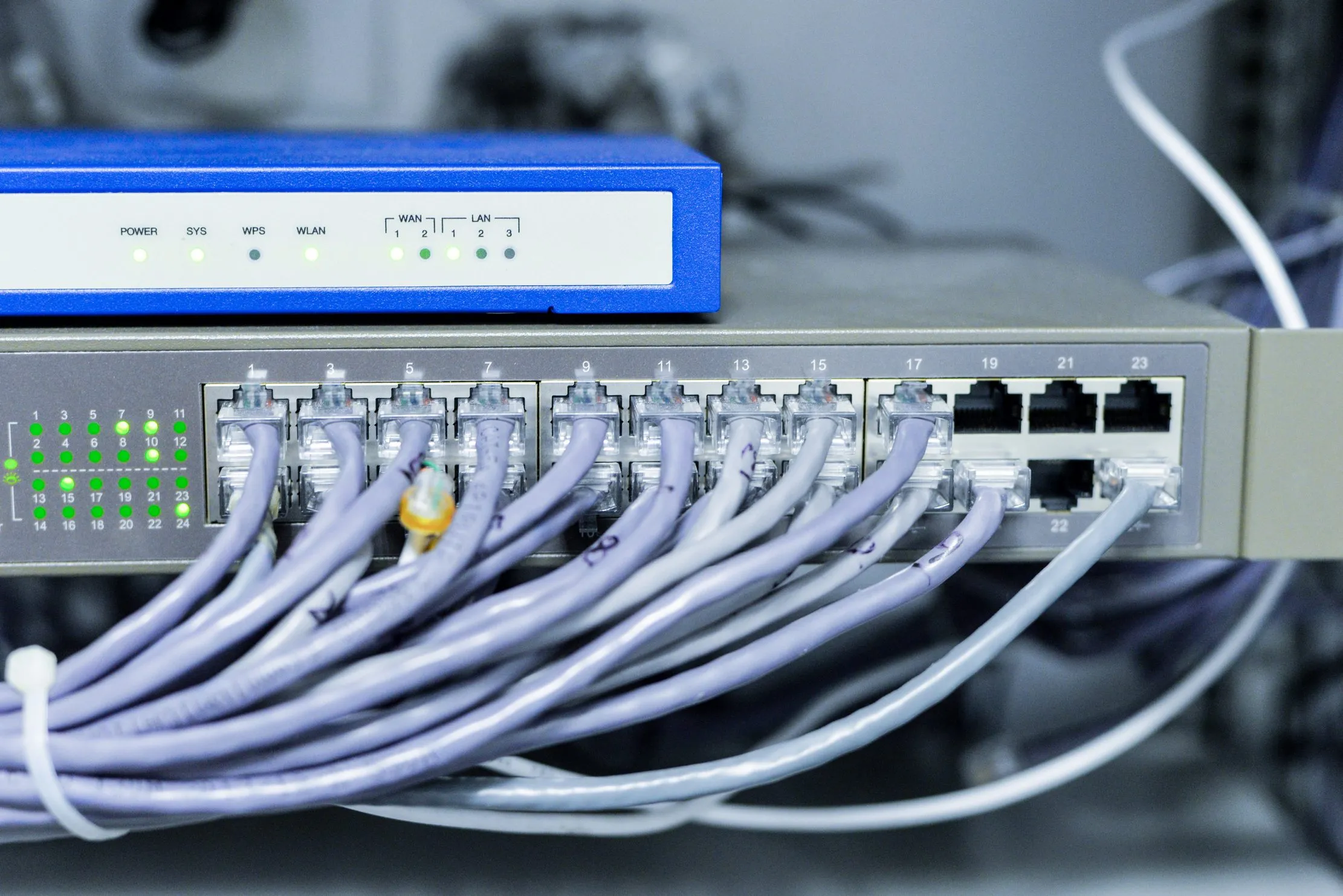 Network switch and router with connected Ethernet cables, representing a branch network equipment map