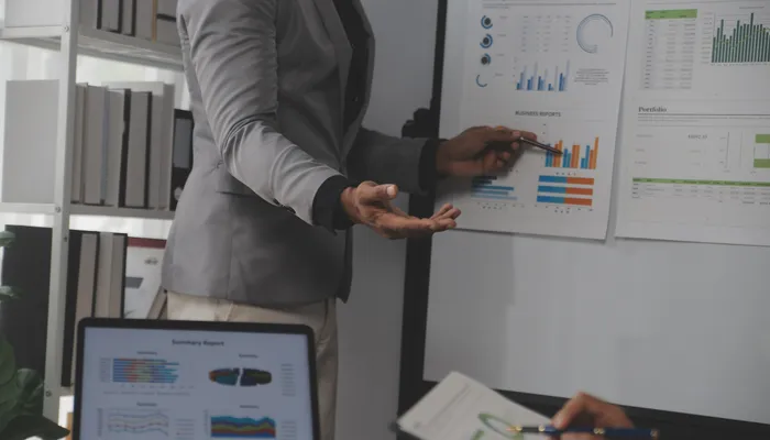 Business leader reviewing financial charts and operational evidence before funding due diligence