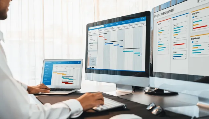 Project manager reviewing a structured digital work plan, representing a careful migration from Excel to a business system