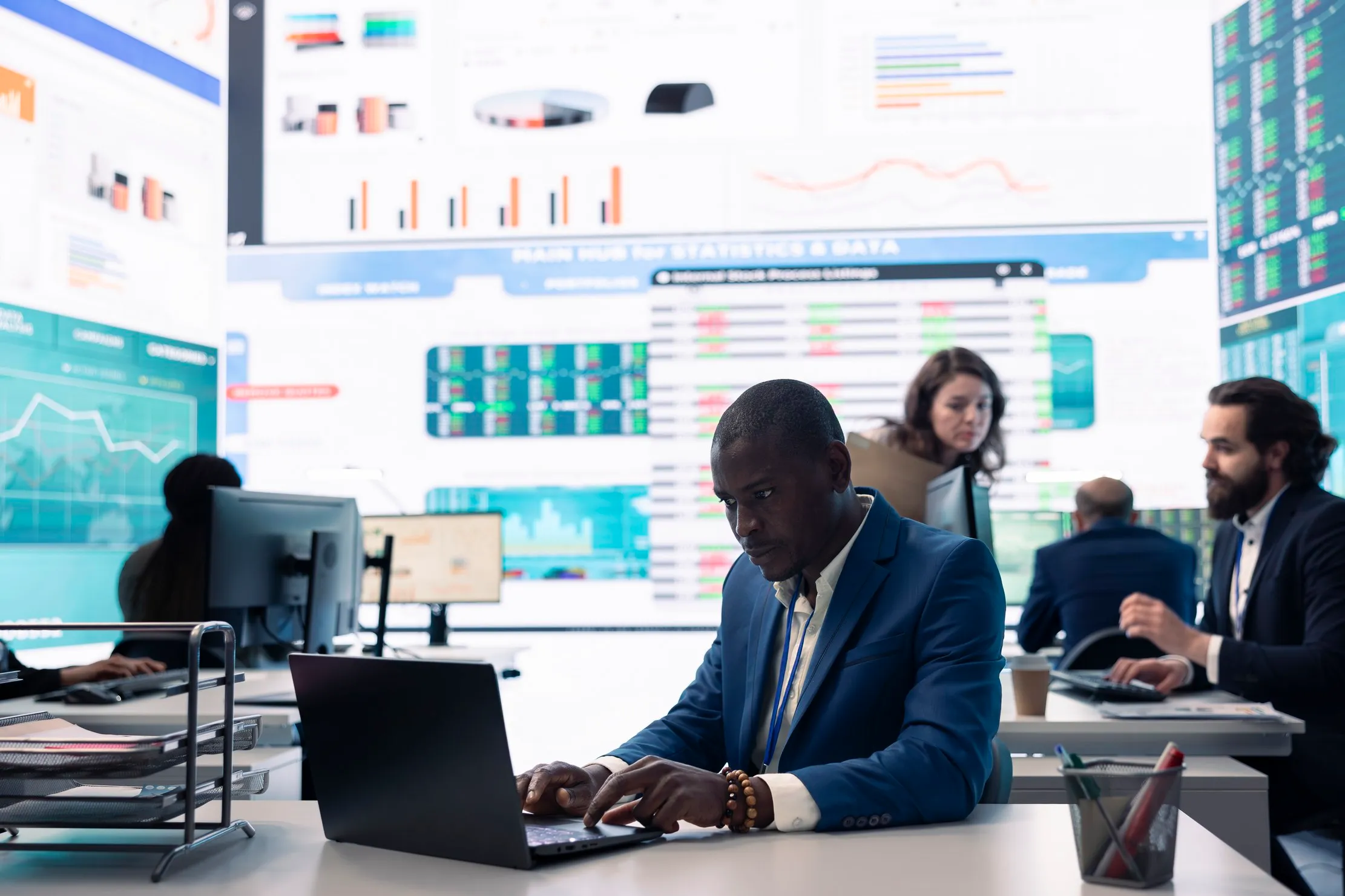 Operations team reviewing shared business dashboards, representing controlled reporting after an Excel migration
