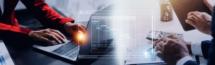 Project manager reviewing a Gantt chart and deliverables schedule for a software project