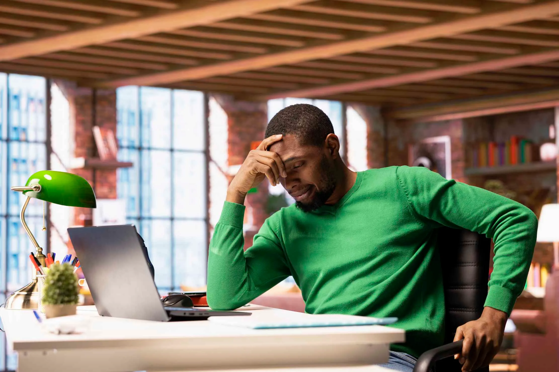 Business owner checking website performance on laptop — improve page speed and reduce bounce rate